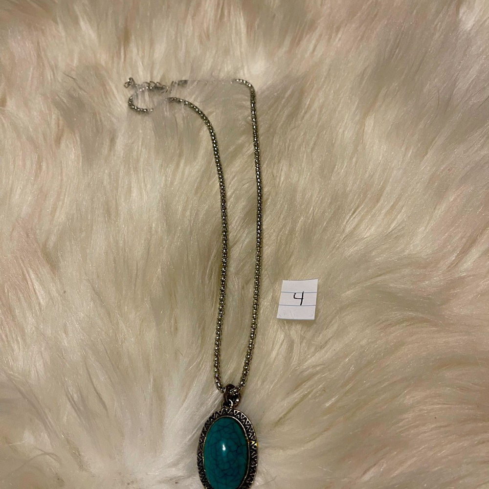 11.5” Silver chain with turquoise pendant.